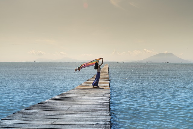 WOMAN WITH SCARF BLOWING IN THE WIND