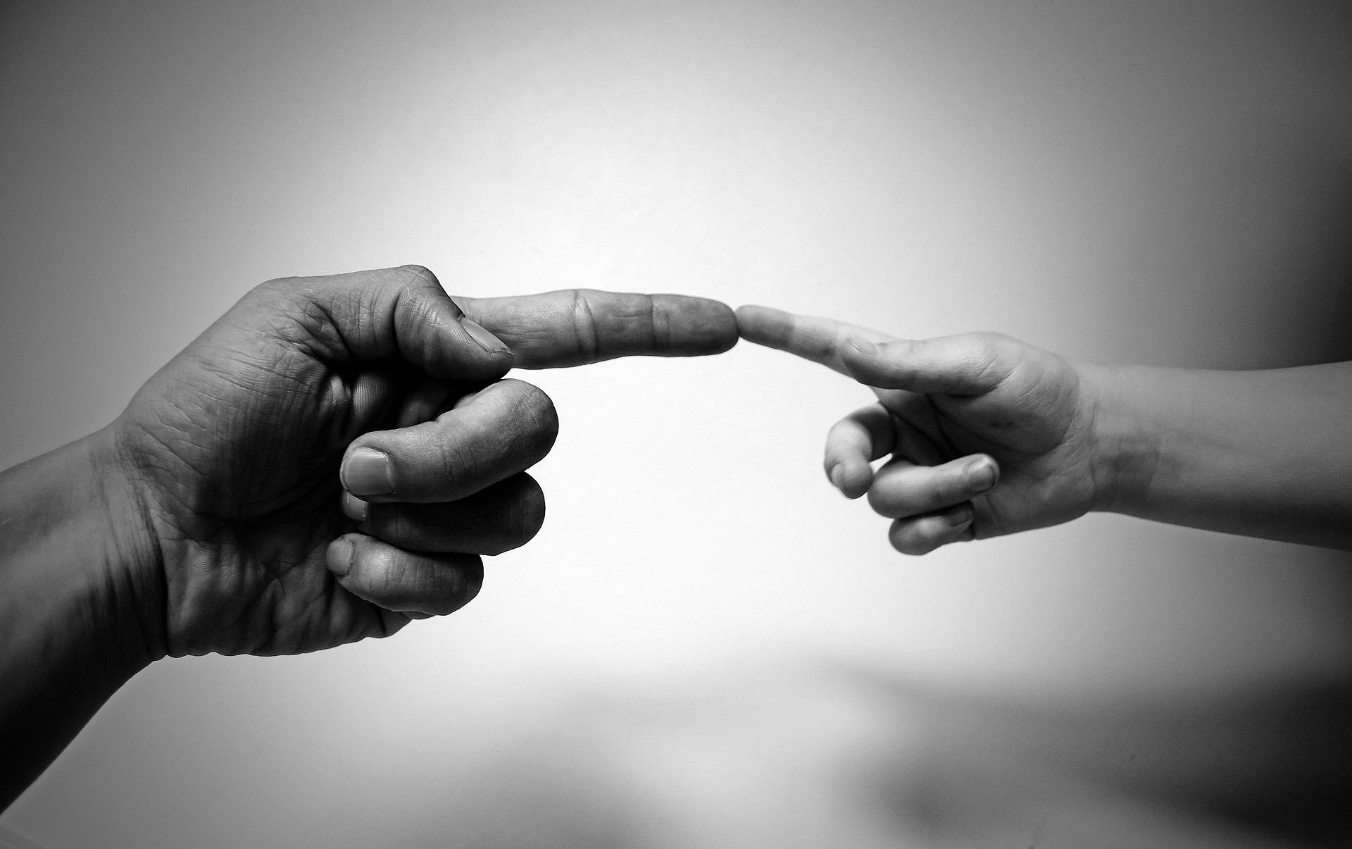 Two fingers reaching out to communicate