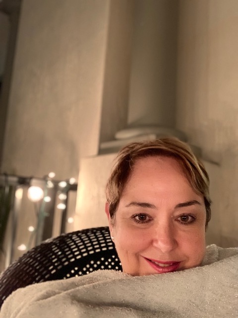 Emy with blanket on balcony