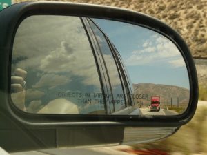 REARVIEW MIRROR WITH VIEW OF A TRUCK