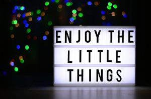 sign that says "enjoy the little things"
