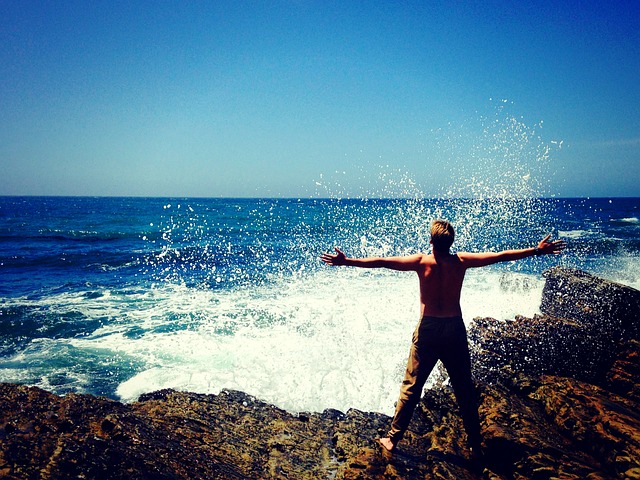 ocean waves with person with arms up