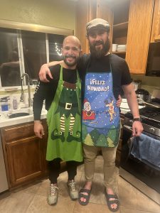 friend and boyfriend in kitchen with aprons