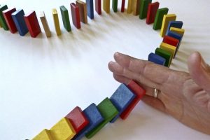 DOMINOES FALLING DOWN